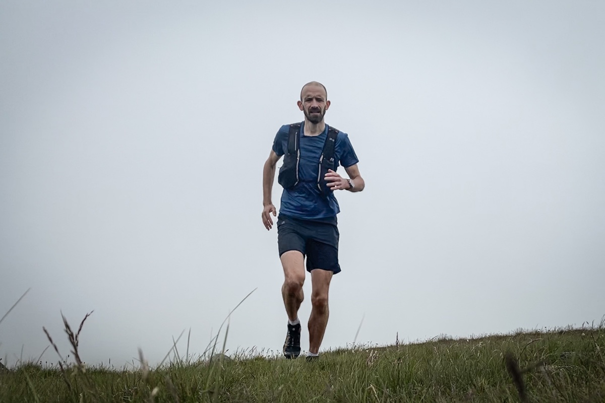 Summiting Hedgehope against a backdrop of cloud