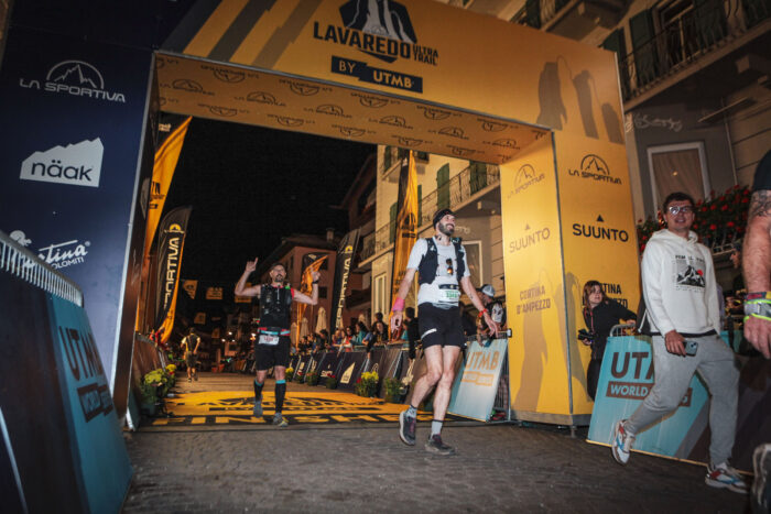 Runners crossing the finish line of Lavaredo Ultra Trail