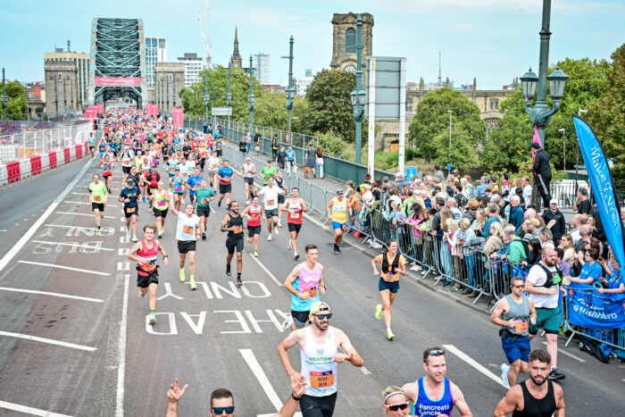 A crowd of runners at the great north run run over the Tyne Bridge in Newcastle.